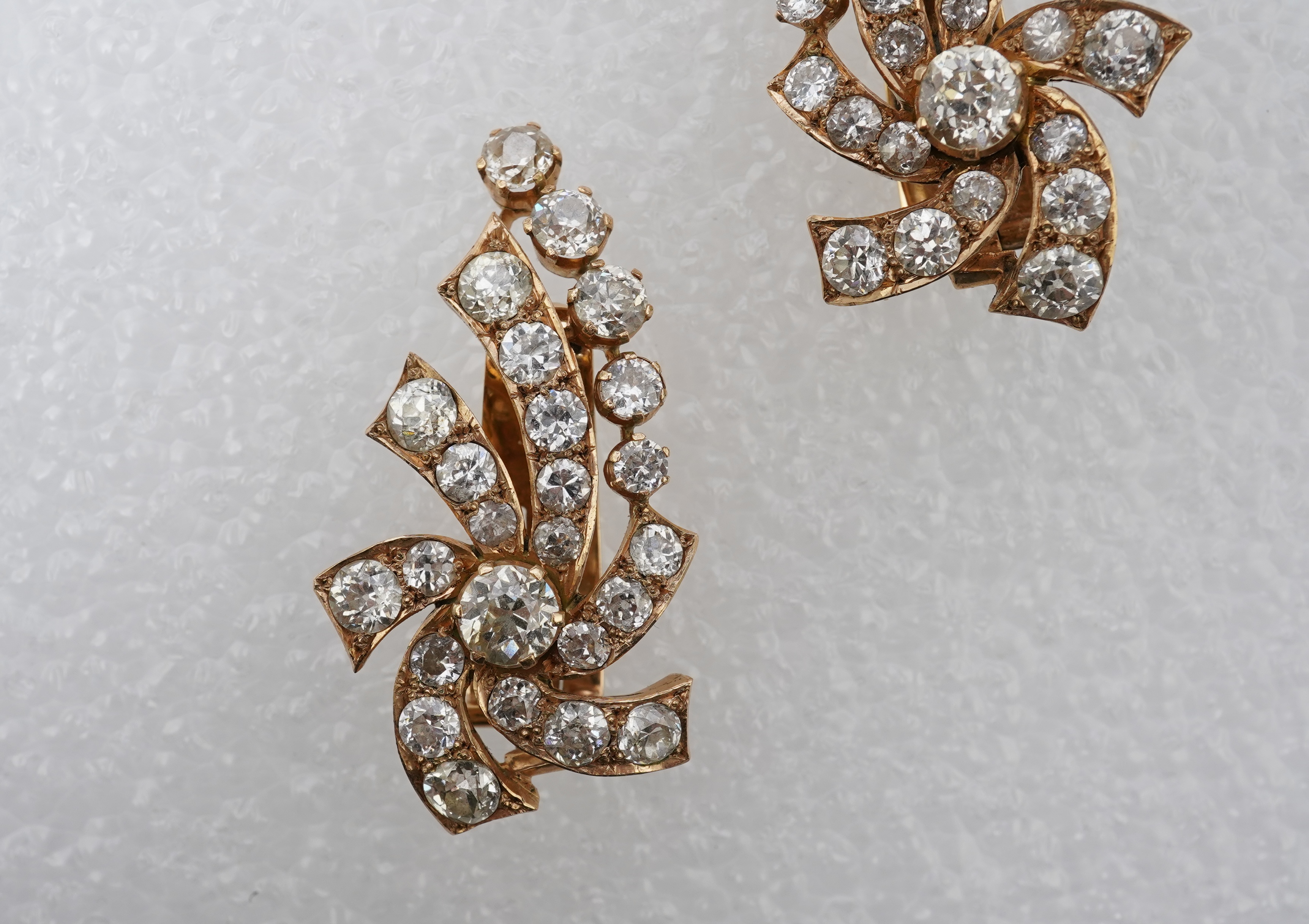 A pair of diamond ear clips, mid 20th century